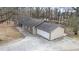 Aerial view of a home showing the roof, garage and long driveway at 1915 Pine Rd, Dacula, GA 30019