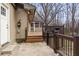 Backyard view showcasing a wooden deck with a grill and a screened porch at 1915 Pine Rd, Dacula, GA 30019