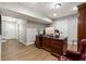 Home office featuring a large wooden desk and hardwood flooring at 1915 Pine Rd, Dacula, GA 30019