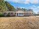 Charming brick home with a well-manicured front lawn and classic curb appeal at 2622 Abington Dr, Snellville, GA 30078