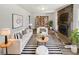 Staged living room featuring a brick fireplace, built in shelves, and stylish décor at 2622 Abington Dr, Snellville, GA 30078