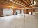 Unfinished basement featuring concrete floors and exposed beams at 1302 Milstead Ne Trce, Marietta, GA 30066