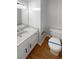 Bathroom featuring a new vanity with granite counter and new toilet at 1302 Milstead Ne Trce, Marietta, GA 30066