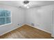 Bright bedroom featuring a modern light fixture and neutral paint at 1302 Milstead Ne Trce, Marietta, GA 30066