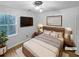 Staged bedroom featuring modern decor, a plush rug and natural light at 1302 Milstead Ne Trce, Marietta, GA 30066