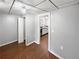 View of the bedroom and open doorway to the compact kitchen at 1302 Milstead Ne Trce, Marietta, GA 30066