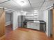 Compact kitchen with stainless steel appliances, modern cabinets, and a farmhouse-style sink at 1302 Milstead Ne Trce, Marietta, GA 30066