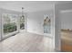 Bright living room featuring tile floors, and large windows with access to the yard at 1302 Milstead Ne Trce, Marietta, GA 30066