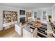 Bright living room featuring a fireplace, built-in bookshelves and hardwood floors at 1302 Milstead Ne Trce, Marietta, GA 30066