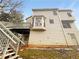Rear exterior view featuring a wooden deck, bay window and neutral siding at 1302 Milstead Ne Trce, Marietta, GA 30066