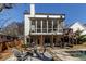 Charming backyard featuring a screened porch, outdoor seating, fire pit, and a refreshing swimming pool at 1537 Harts Mill Ne Rd, Brookhaven, GA 30319