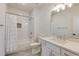Well-lit bathroom features modern vanity, toilet, and shower with white tile at 1537 Harts Mill Ne Rd, Brookhaven, GA 30319