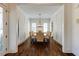 Bright dining room with hardwood floors, wainscoting, and a stylish chandelier at 1537 Harts Mill Ne Rd, Brookhaven, GA 30319