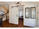 Elegant foyer with hardwood floors, staircase, a sliding barn door and stylish decor at 1537 Harts Mill Ne Rd, Brookhaven, GA 30319
