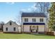 Charming two-story white home showcasing a well-manicured lawn and classic architectural details at 1537 Harts Mill Ne Rd, Brookhaven, GA 30319