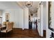 Elegant hallway featuring hardwood floors, a modern light fixture, and barn door entrance at 1537 Harts Mill Ne Rd, Brookhaven, GA 30319