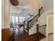Grand hallway showcasing hardwood floors, staircase, high ceilings, and an adjacent dining area at 1537 Harts Mill Ne Rd, Brookhaven, GA 30319