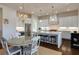 Bright kitchen with white cabinets, stainless appliances, a large island, and modern pendant lighting at 1537 Harts Mill Ne Rd, Brookhaven, GA 30319