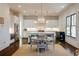 Bright kitchen with white cabinetry, stainless appliances, large island, and adjacent dining area at 1537 Harts Mill Ne Rd, Brookhaven, GA 30319