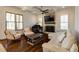 Cozy living room with coffered ceilings, hardwood floors, a stone fireplace, and a grand piano at 1537 Harts Mill Ne Rd, Brookhaven, GA 30319