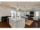 Open-concept living room flowing from a bright kitchen with an island into a comfortable sitting area at 1537 Harts Mill Ne Rd, Brookhaven, GA 30319