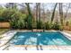 Beautiful pool surrounded by lush landscaping, perfect for relaxation and enjoying the outdoors at 1537 Harts Mill Ne Rd, Brookhaven, GA 30319