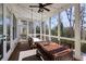 Inviting screened porch with a hanging daybed, dining table, string lights and outdoor scenery at 1537 Harts Mill Ne Rd, Brookhaven, GA 30319