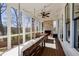 Spacious screened-in porch with a hanging bed, dining area, fireplace, and views of the backyard at 1537 Harts Mill Ne Rd, Brookhaven, GA 30319