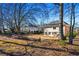 View of backyard shows a patio and wooded surroundings at 3840 Montvale Xing, Cumming, GA 30041