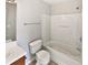 Bright bathroom with tub shower combo, vanity and tile floors at 1100 Cotton Gin Dr, Woodstock, GA 30188