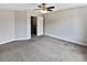 Carpeted bedroom features large closet and ceiling fan at 1100 Cotton Gin Dr, Woodstock, GA 30188