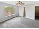 Spacious bedroom features a ceiling fan, large windows and a walk-in closet at 1100 Cotton Gin Dr, Woodstock, GA 30188
