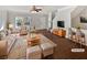 Bright living room with hardwood floors, neutral walls, a ceiling fan, and two comfy chairs and sofa at 1100 Cotton Gin Dr, Woodstock, GA 30188