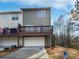 Rear exterior of home showing a deck, garage and fire hydrant at 1100 Cotton Gin Dr, Woodstock, GA 30188