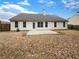 Backyard featuring a concrete patio with a view of the back of the house at 2545 Lakemeadow Ln, Grayson, GA 30017