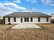 The backyard features a well-maintained lawn, patio, and a view of the home's exterior at 2545 Lakemeadow Ln, Grayson, GA 30017