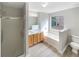Bathroom featuring a soaking tub, a separate glass shower, and double vanity at 2545 Lakemeadow Ln, Grayson, GA 30017