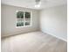 Bedroom with a view, featuring neutral walls, plush carpeting, and lots of natural light at 2545 Lakemeadow Ln, Grayson, GA 30017