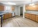 Kitchen with stainless steel appliances, granite countertops, new flooring, and ample cabinet space at 2545 Lakemeadow Ln, Grayson, GA 30017