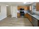 Modern kitchen with stainless steel appliances, granite countertops, and ample cabinet space at 2545 Lakemeadow Ln, Grayson, GA 30017