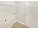 Practical laundry room with storage shelves and connections for a washer and dryer at 2545 Lakemeadow Ln, Grayson, GA 30017