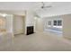 Spacious living room with a ceiling fan, fireplace, and windows for natural light at 2545 Lakemeadow Ln, Grayson, GA 30017