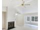 Living room with a fireplace and vaulted ceiling, and a large window at 2545 Lakemeadow Ln, Grayson, GA 30017