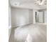 Bright main bedroom featuring tray ceiling, multiple windows, and neutral decor at 2545 Lakemeadow Ln, Grayson, GA 30017