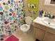 Functional bathroom featuring a colorful shower curtain and basic fixtures at 2041 Marbut Trce, Lithonia, GA 30058