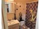Bathroom featuring a themed shower curtain and vanity with a sink at 2041 Marbut Trce, Lithonia, GA 30058
