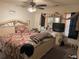 Bedroom with a large bed, dresser, television, and coordinated curtains at 2041 Marbut Trce, Lithonia, GA 30058