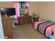 Bedroom with a dresser, television, and pink zebra-striped accents at 2041 Marbut Trce, Lithonia, GA 30058