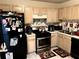 Functional kitchen equipped with modern appliances and ample cabinet space at 2041 Marbut Trce, Lithonia, GA 30058