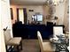 Open-concept living space with a cozy living room and an adjacent dining area at 2041 Marbut Trce, Lithonia, GA 30058